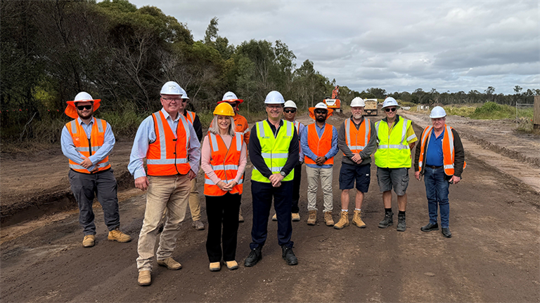 Group of people standing on Scrubb Hill Road work area