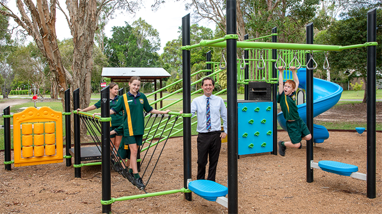 Mayor George Seymour and group of local children at playground on Gilston Road