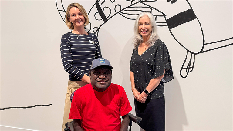 Alywarr artist Dion Beasley, Hervey Bay Regional Gallery Director Sarah Thomson, and Cr Michelle Govers