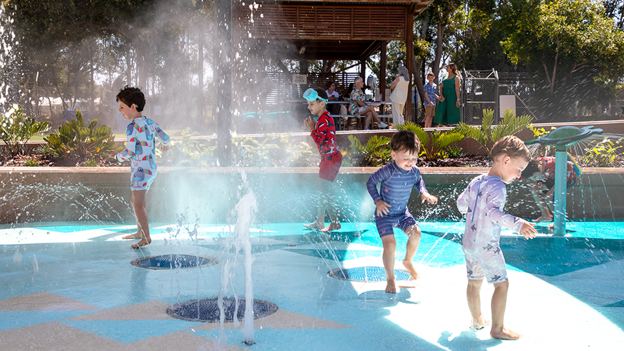 Children playing in water play area