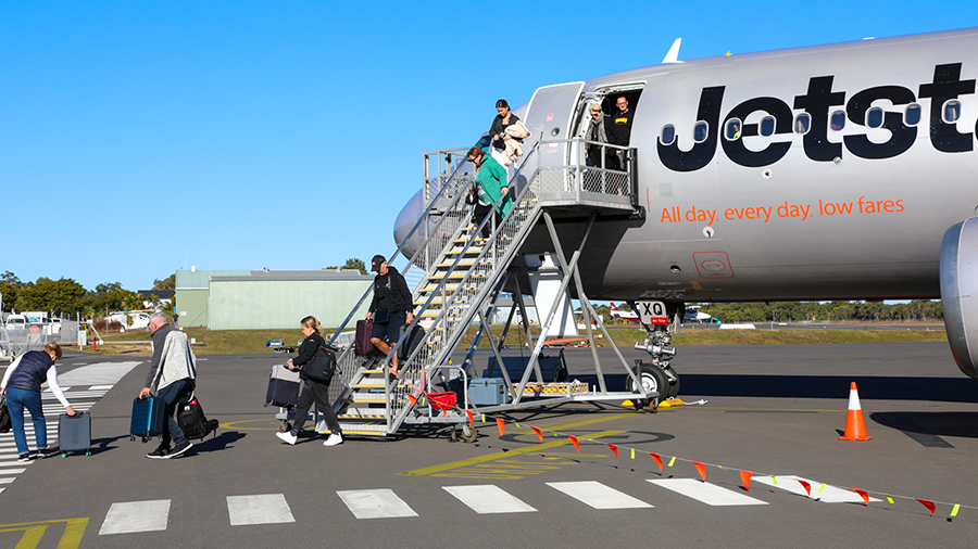 Jetstar flight passengers departing the plane