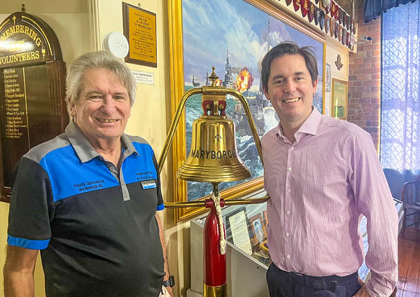 The Maryborough Military and Colonial Museum's Greig Bolderrow with Mayor George Seymour and a replica of HMAS Maryborough's bell