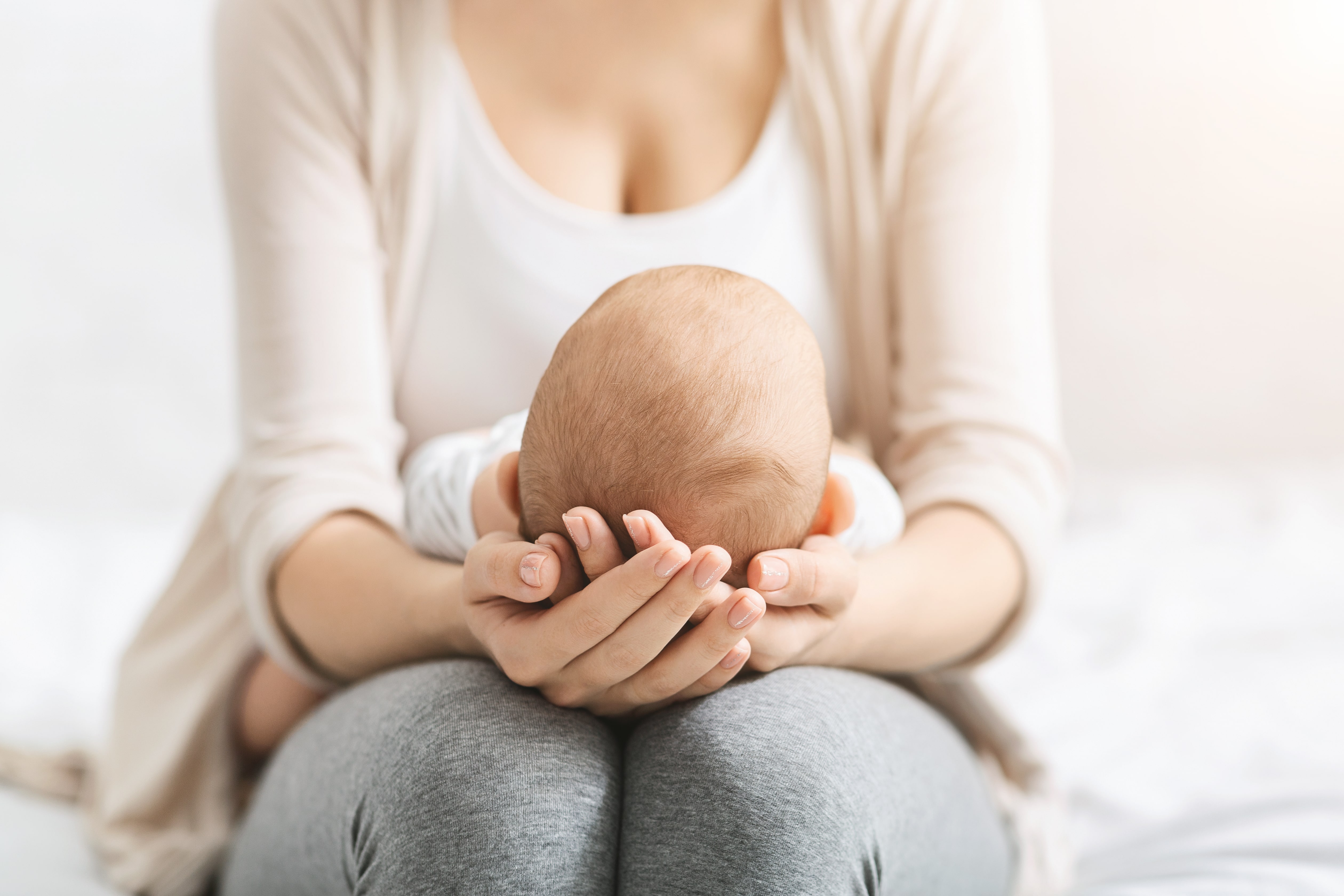 mother holding baby